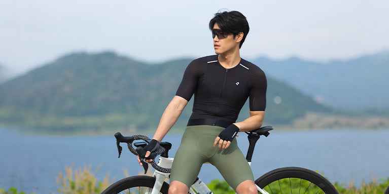 Black short-sleeved cycling jersey with subtle white trim features upgraded coolmax loved by cyclists swear by for comfort.