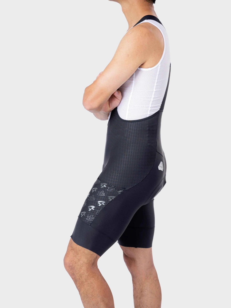 Bakifrån LAMEDA azure drift herr cykelbibshorts i marinblå jacquardväv med nätpanel och logomönster på sidan