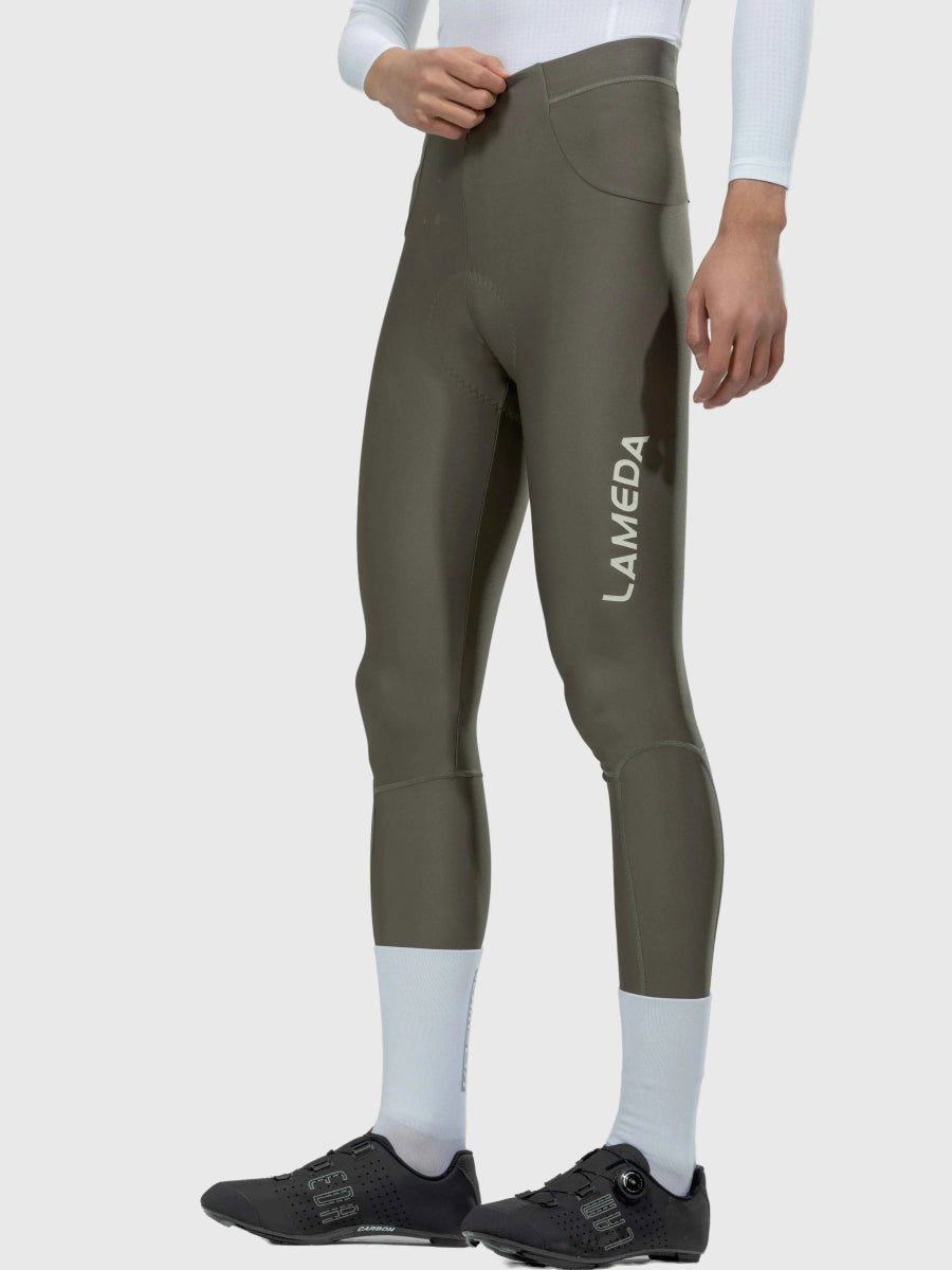 Olive green lameda chic men’s cycling tights with sleek form-fitting design and subtle white leg branding