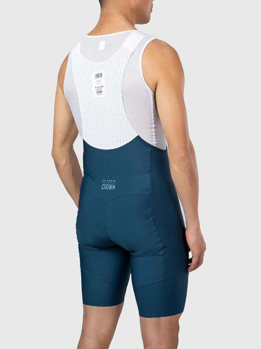 Dazzling men’s bib shorts in white mesh and deep teal fabric with branded crown logo on back for cycling bib shorts