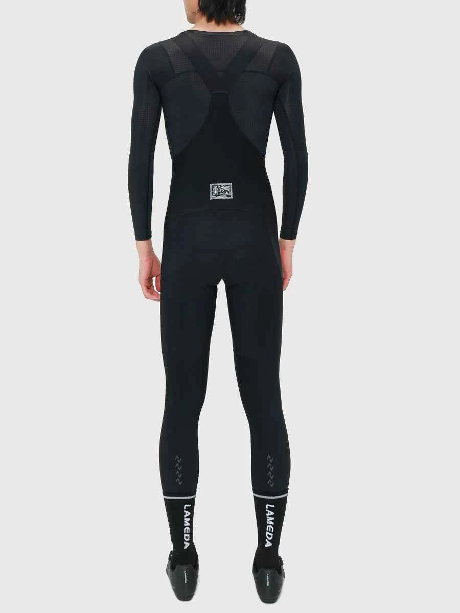 Drift herrars termiska fleecefodrade bibtights i svart med svart LAMEDA helkroppsvåtdräkt med nätpaneler och diskret vit märkning på benen