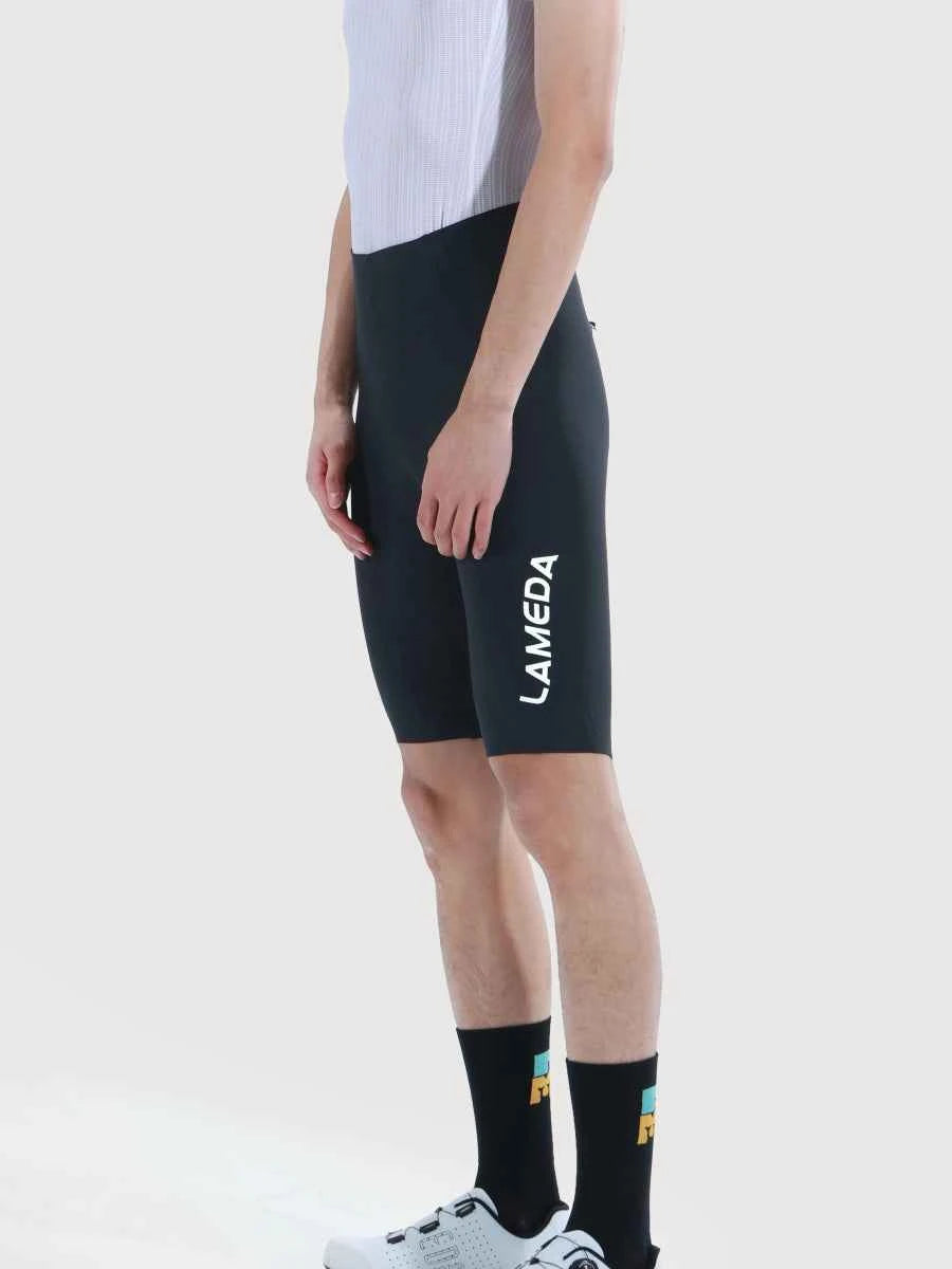 Black lameda glide men cycling shorts with sleek form-fitting design and white branding on the side for performance riding