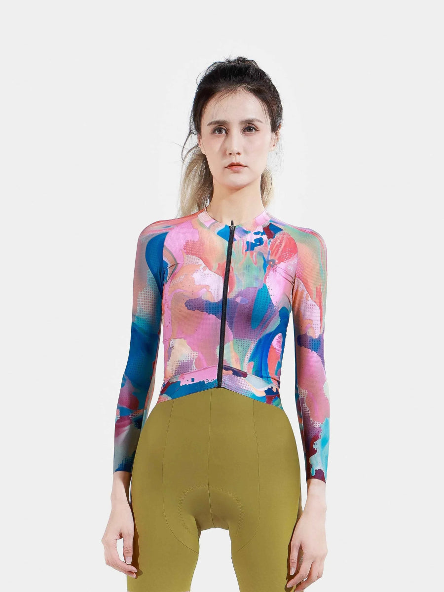 Hue långärmad damcykeltröja i rökrosa med djärv färgstänksdesign tillverkad av toray polyester som avleder svett