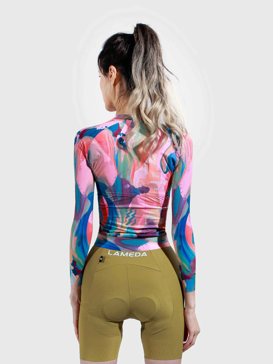 Hue långärmad damcykeltröja i rökrosa med färgglad färgstänksdesign tillverkad av toray-polyester som avleder svett
