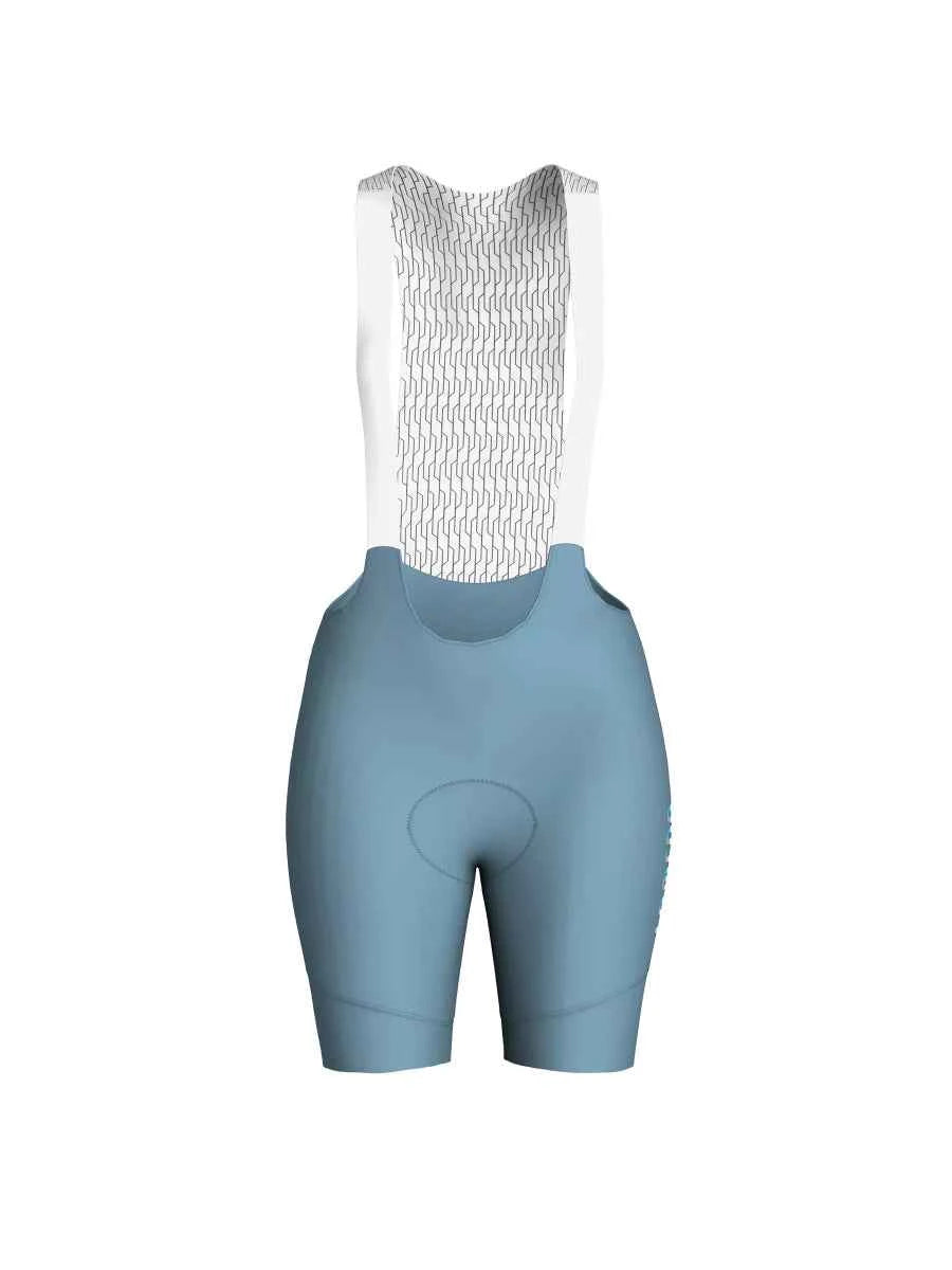 Ljusblå jade dams cykelhängselshorts med bakpanel i vit nätväv och polstrat sadelparti för grundläggande cykling