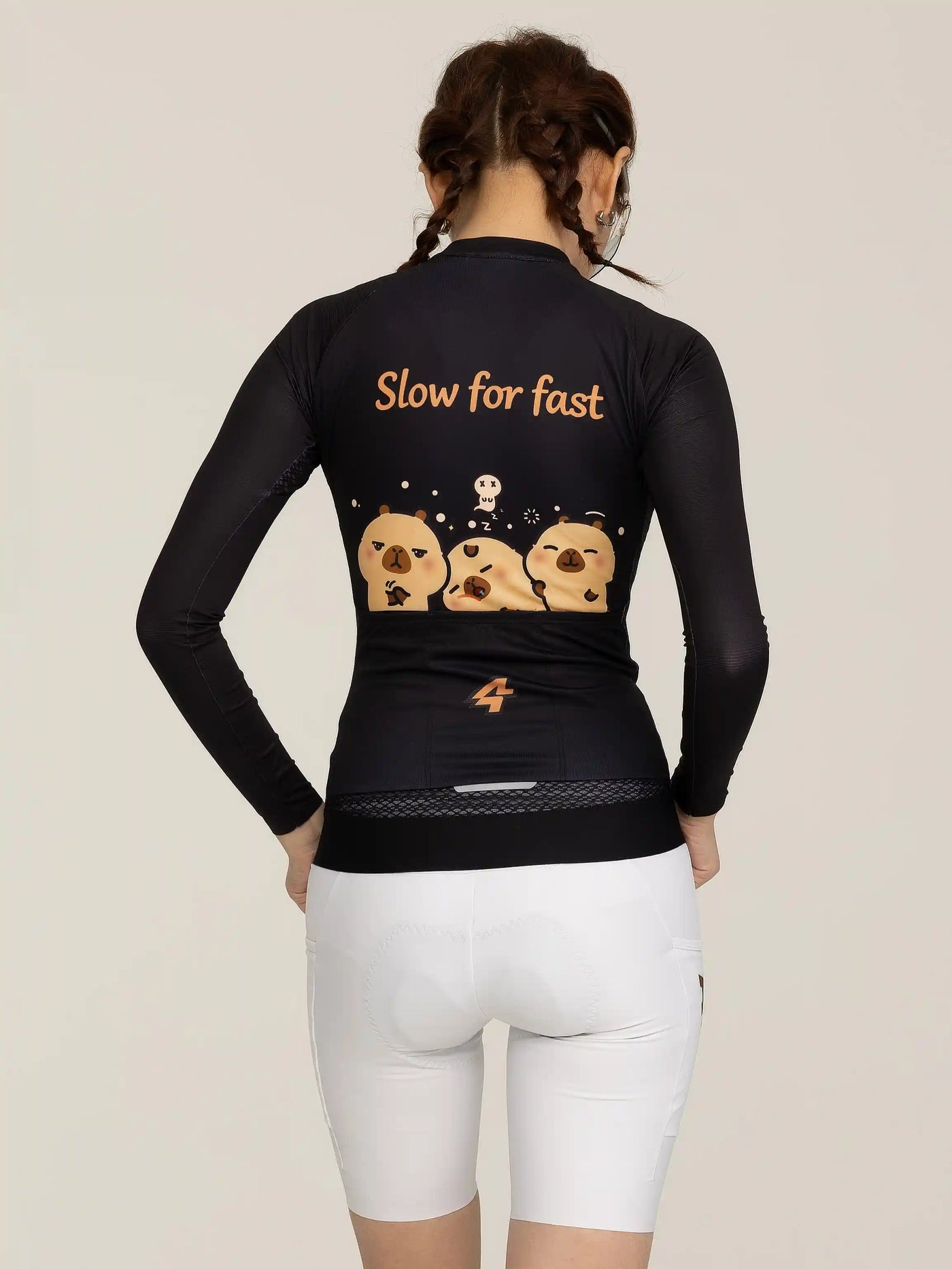 Baksida av LAMEDA x capybara australian studio unisex cykeltröja svart långa ärmar med slow for fast-text och capybara-grafik