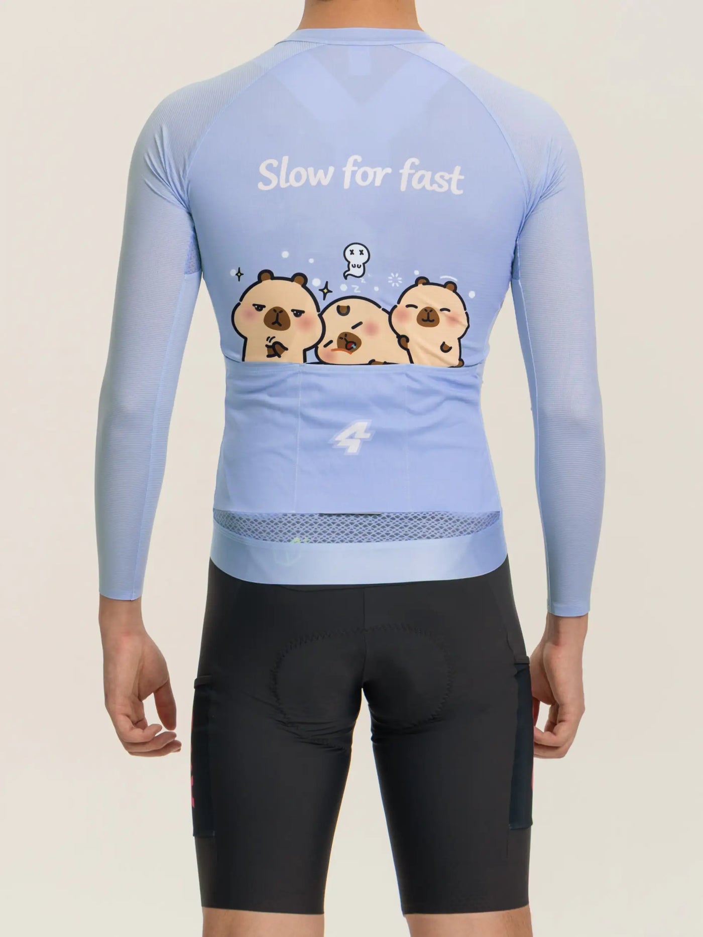 Baksida av ljusblå LAMEDA x capybara unisex cykeltröja med lekfull capybara-grafik och texten slow for fast