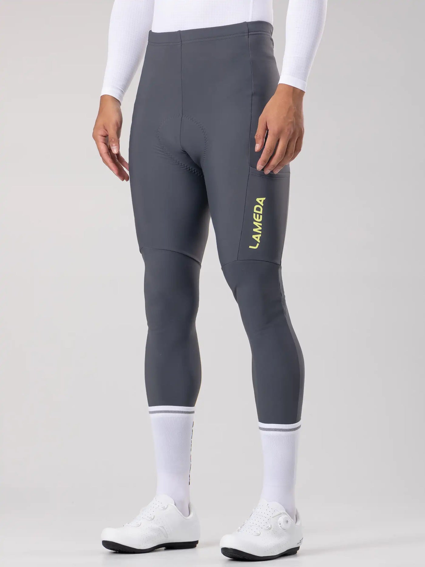 Dark gray lameda 20th anniv special men’s thermal cycling tights with elastic interface and subtle yellow logo on thigh