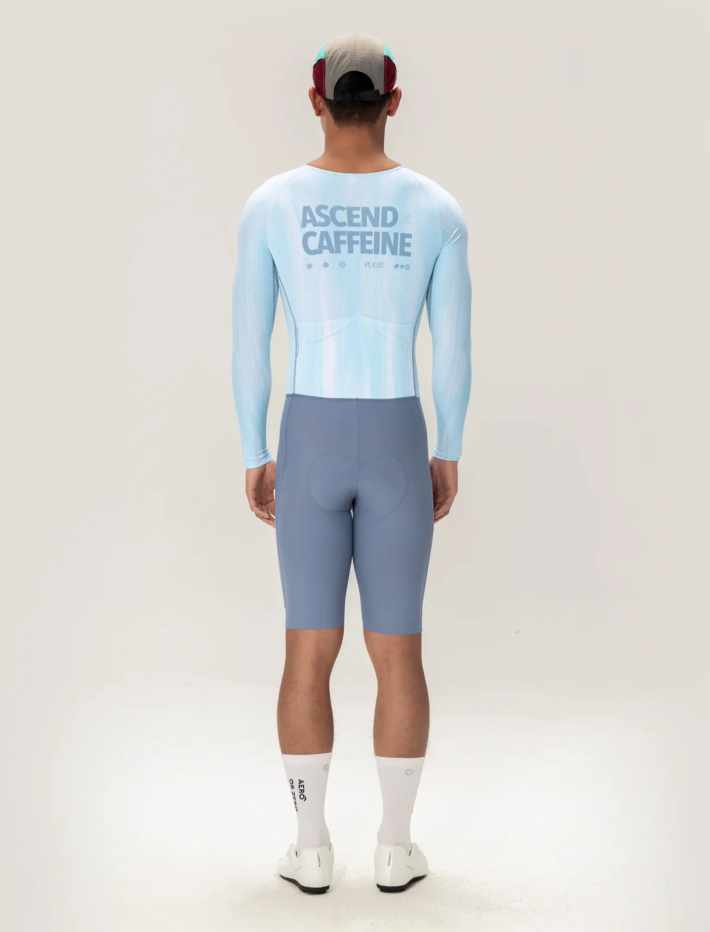 Light blue long-sleeved cycling skinsuit back with ascend caffeine printed in dark gray for men