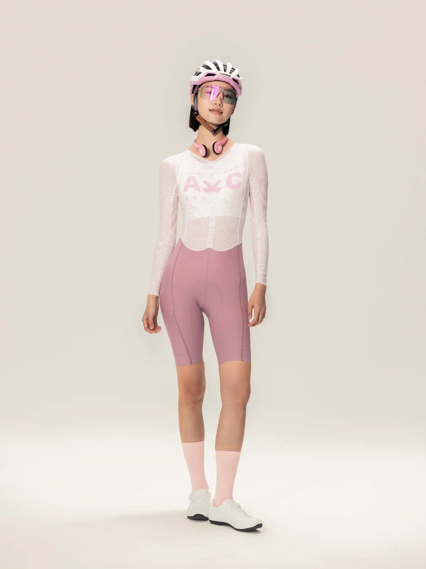 LAMEDA A*C damcykelskinsuit med långa ärmar i rosa och vit med nätpaneler och anpassad passform