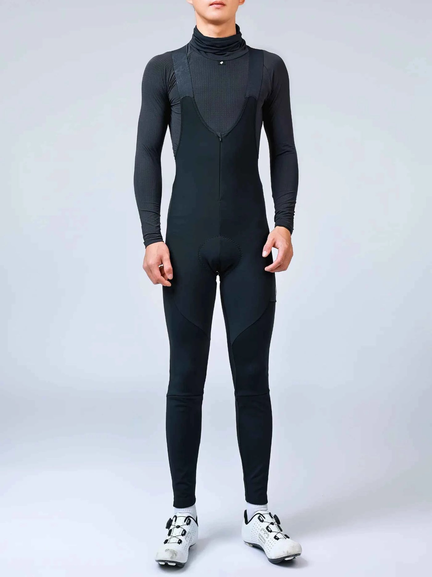 Black form-fitting thermal bib tights with subtle textured panels and high collar spear men’s thermal fleeced bib tights