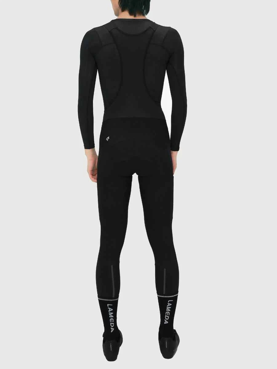 Black full-body thermal fleeced bib tights s441 with reinforced back panels and lameda branding on lower legs back view