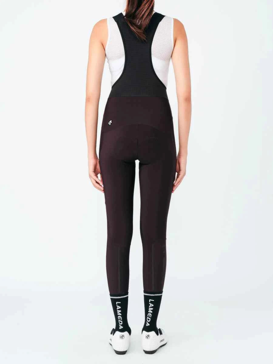 Svarta värmande fleecefodrade bibtights med vita axelpartier av nät och logotyp nära midjebandet bibtights s469 lila modell