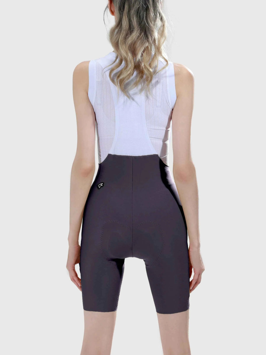 mörkgrå radiant damcykelbibshorts tillsammans med vit ärmlös topp passande för cykling med cykelbibshorts