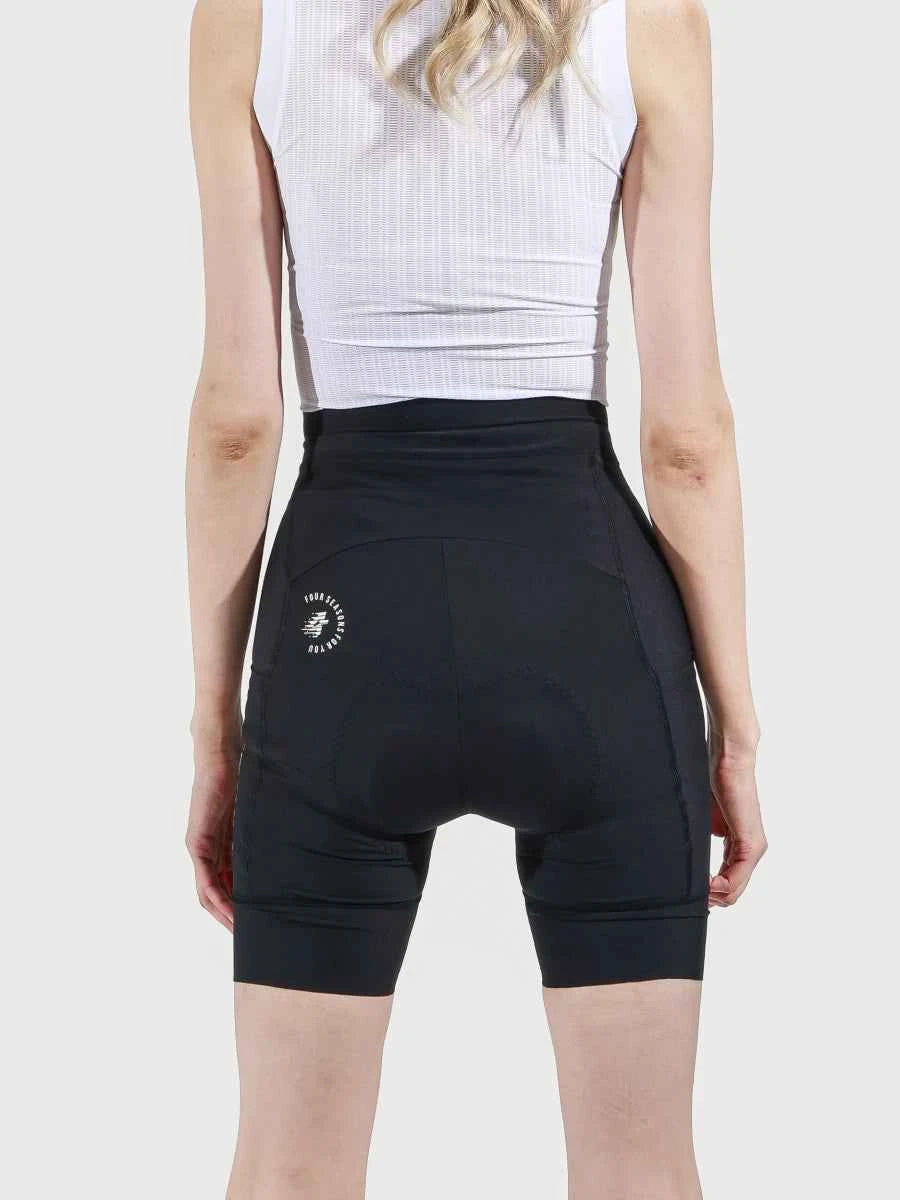 Svart LAMEDA reverie damcykelshorts med magkontroll och vadderad sits visas bakifrån med vit logotyp