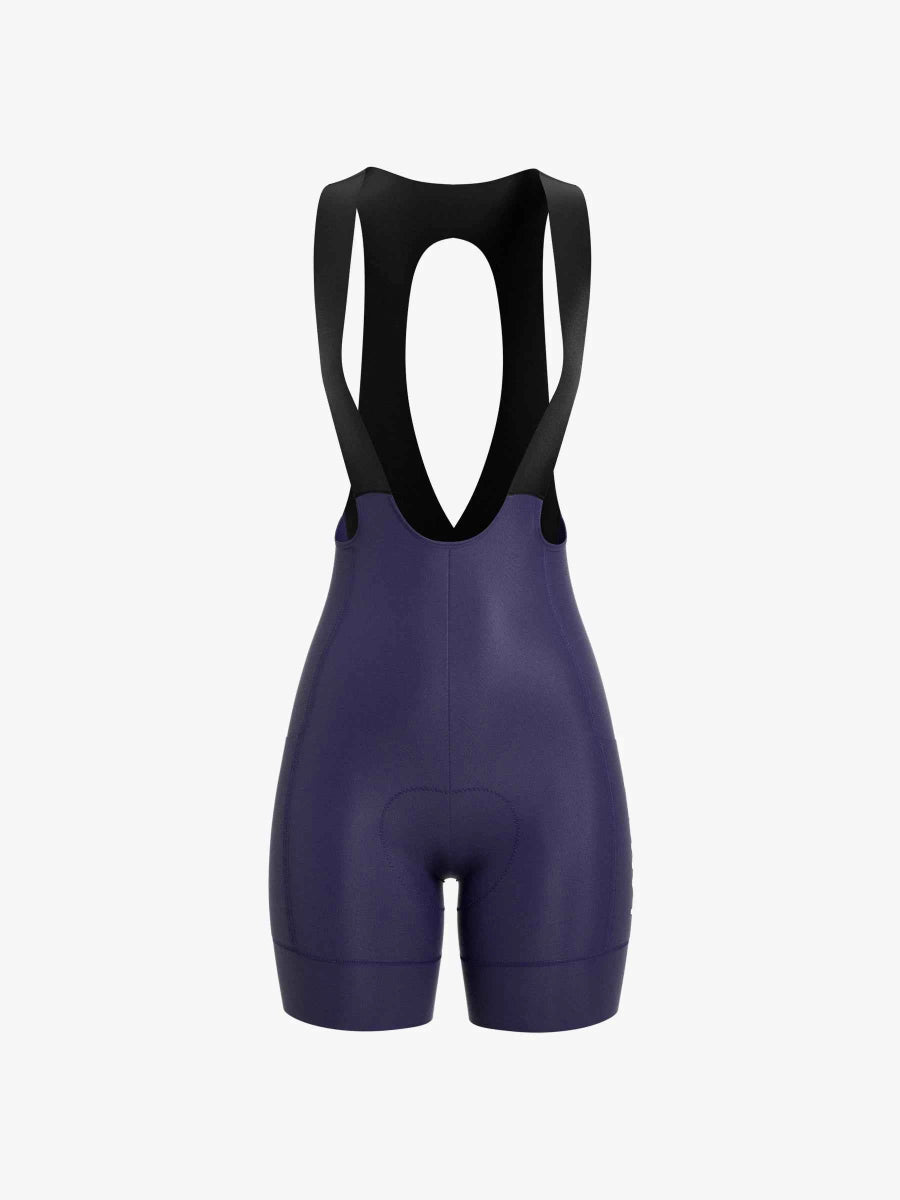 Soothe damcykelbibshorts i änglila med svarta justerbara hängremmar och formpassande design från LAMEDA