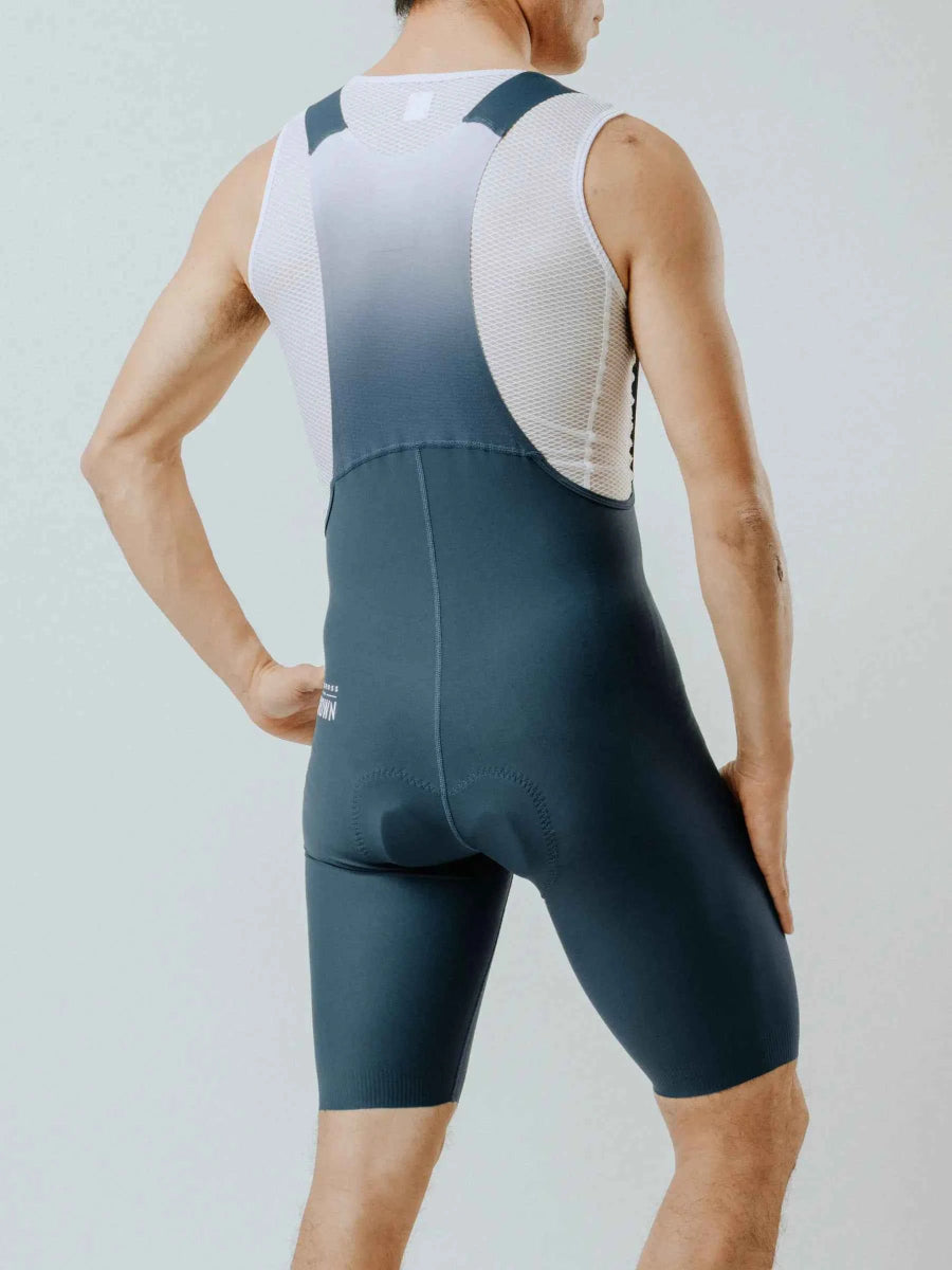 Strömlinjeformade starlight herrcykelbibshorts i gradient blågrön med nätpaneler och vadderad chamois för komfort