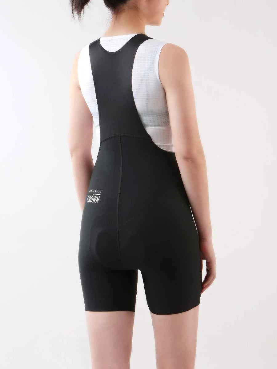 Achterzicht van LAMEDA starlight dames zwarte fietsbibbroek met wit paneel en 4-way stretch stof