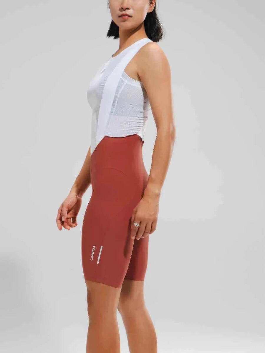 rostfärgade pro cykelhängselshorts för damer med vit logotyp elastic interface polstring och upf50+ solskydd