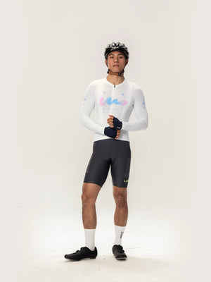 White long-sleeved lameda women’s cycling jersey with pastel blue and pink logo accents for women’s cycling jersey use